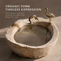 VELMIRN® crane stone sculptural bowl — organic form timeless expression, top angle with golden cranes